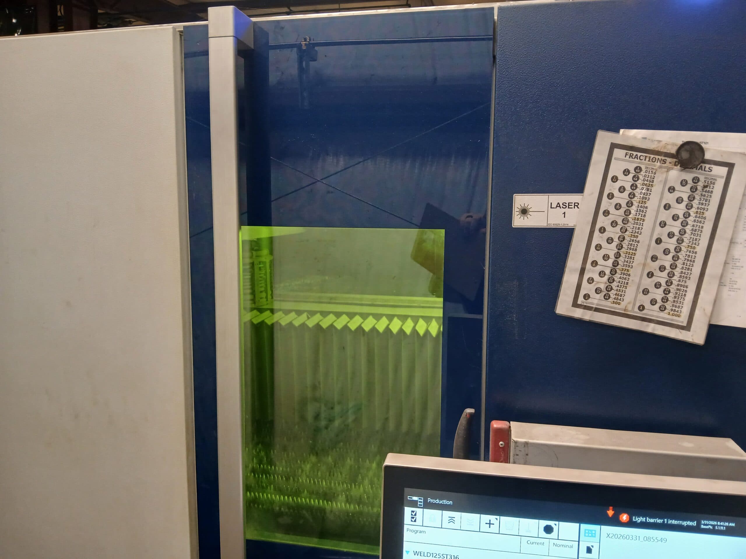 TCM technician operating Trumpf laser controls